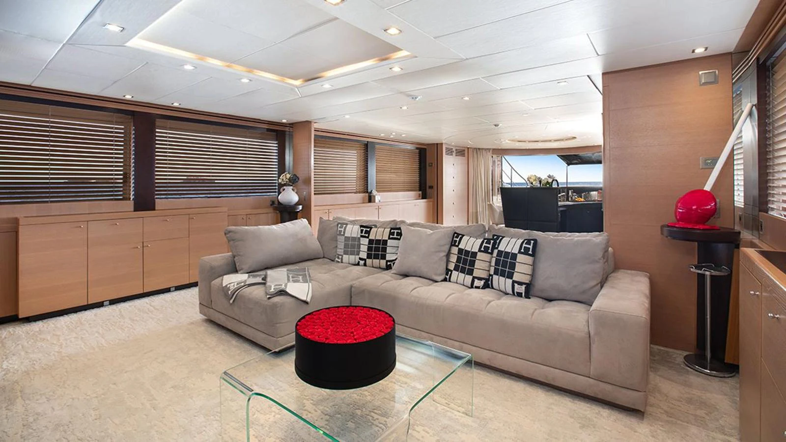 The salon features a spacious and modern design with a comfortable seating area and stylish decor. aboard YCM 120 Yacht for Sale
