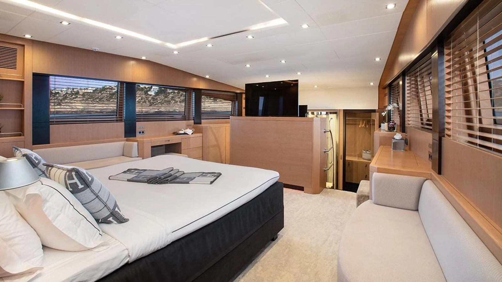 The master stateroom offers a spacious and luxurious retreat with modern furnishings and ample natural light. aboard YCM 120 Yacht for Sale