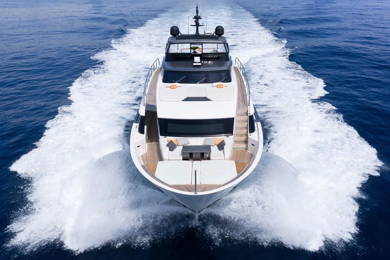 A sleek yacht cuts through the water, showcasing its powerful design and luxurious amenities. aboard JACKI 8 Yacht for Sale