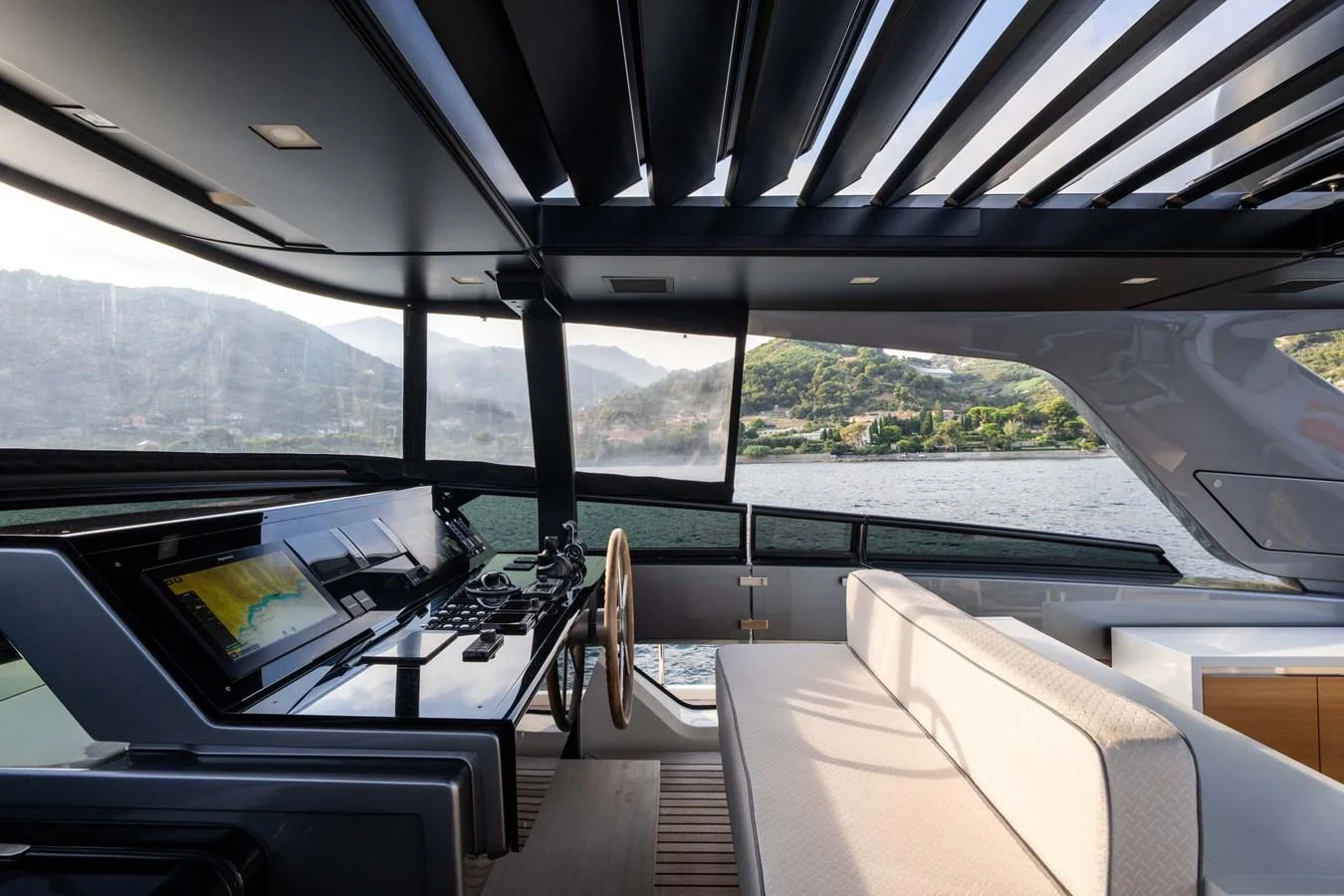 The helm area features a sleek design with panoramic views and modern navigation equipment. aboard JACKI 8 Yacht for Sale