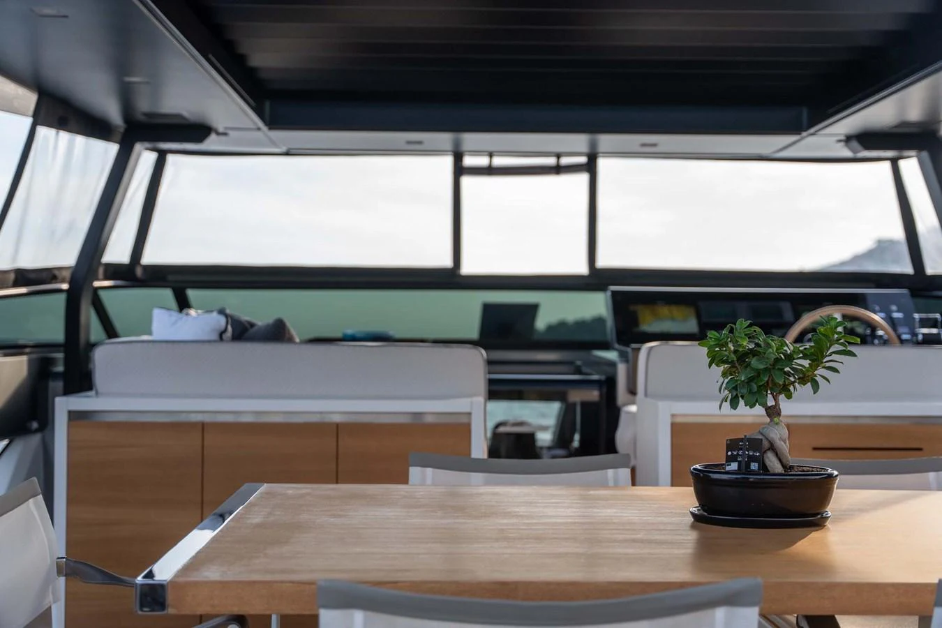 The salon features a modern design with a spacious layout and large windows offering panoramic views. aboard JACKI 8 Yacht for Sale