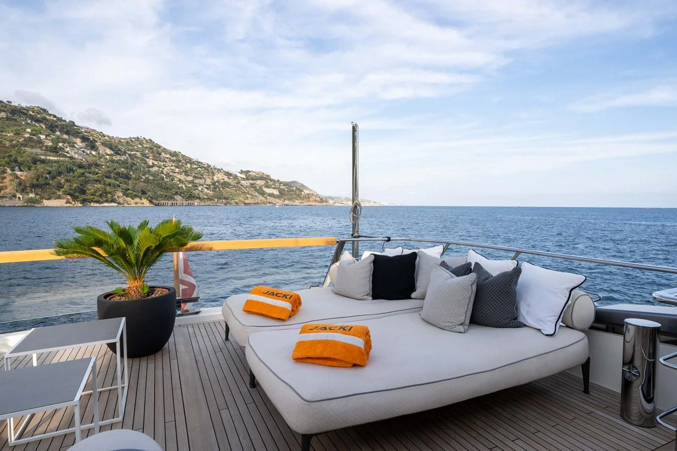 The sundeck offers a luxurious lounging area with stunning sea views. aboard JACKI 8 Yacht for Sale