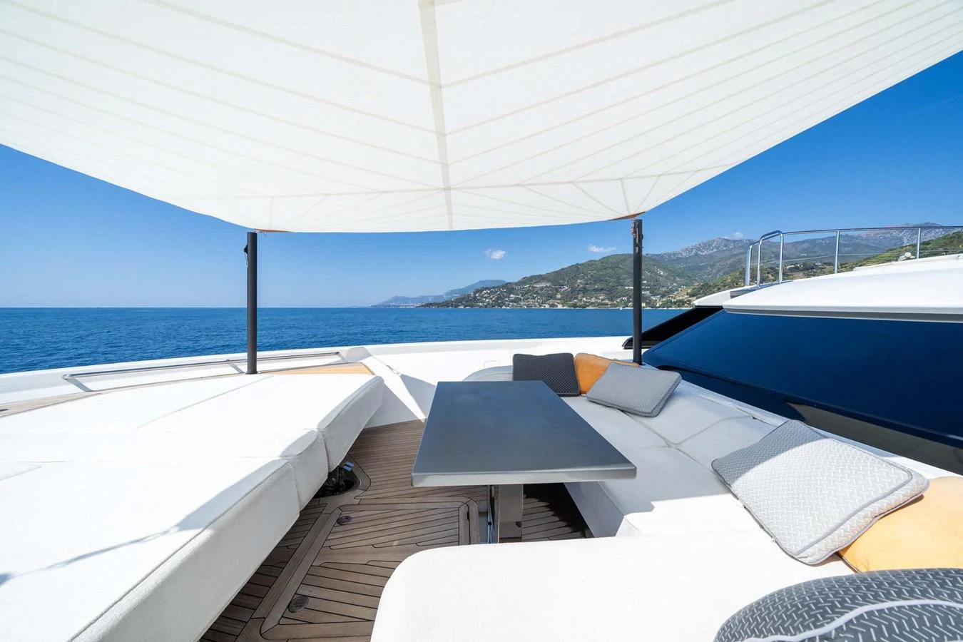 The sundeck offers a luxurious lounging area with comfortable seating and stunning ocean views. aboard JACKI 8 Yacht for Sale