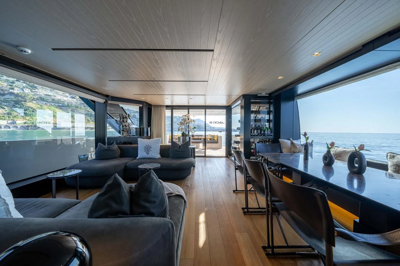 The salon offers a spacious and luxurious area with ample seating and panoramic views. aboard JACKI 8 Yacht for Sale