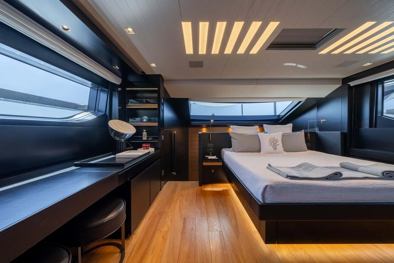 The master stateroom exudes modern elegance with its sleek design and ambient lighting. aboard JACKI 8 Yacht for Sale