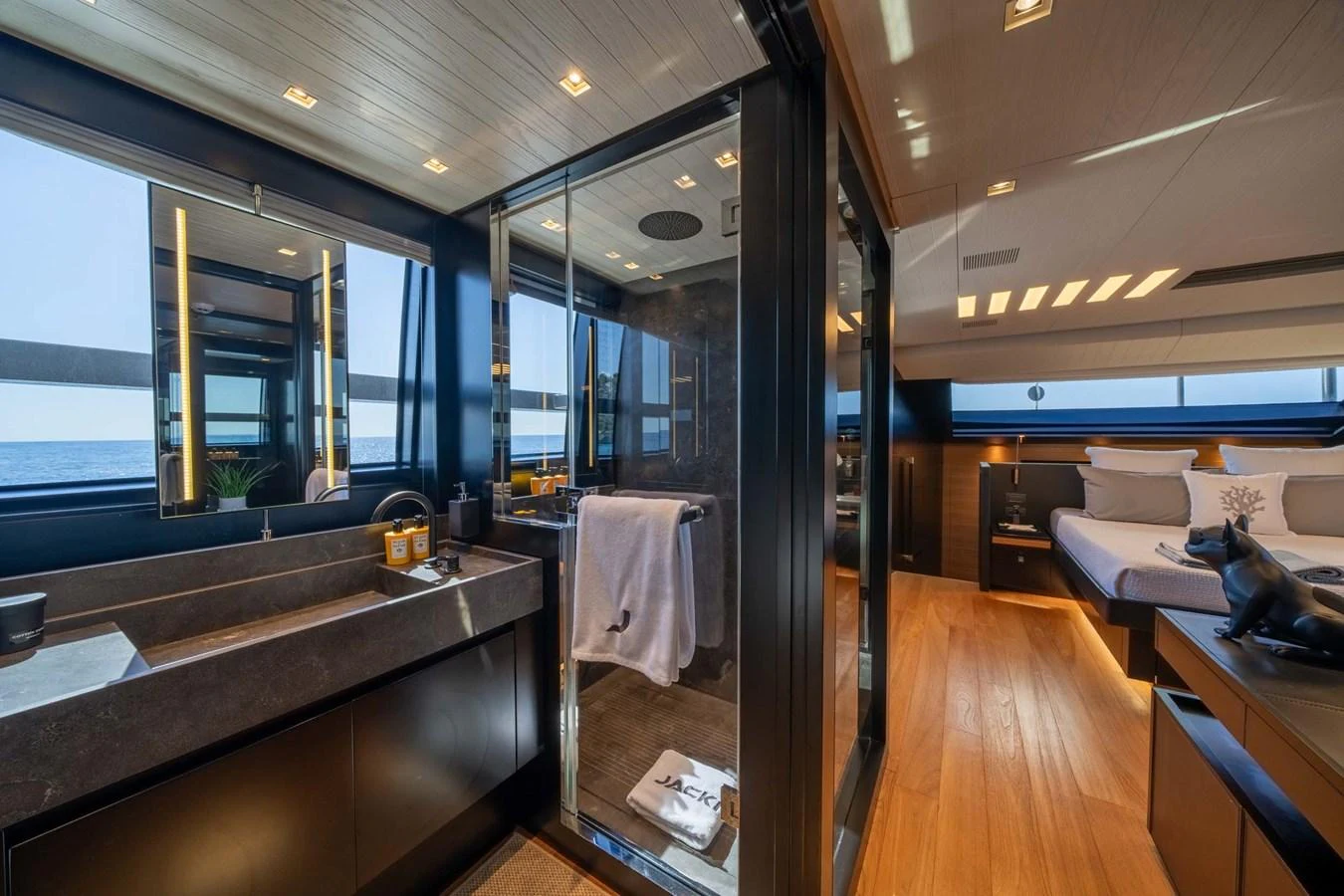 The master stateroom features a luxurious ensuite bathroom with modern fixtures and expansive windows offering stunning sea views. aboard JACKI 8 Yacht for Sale