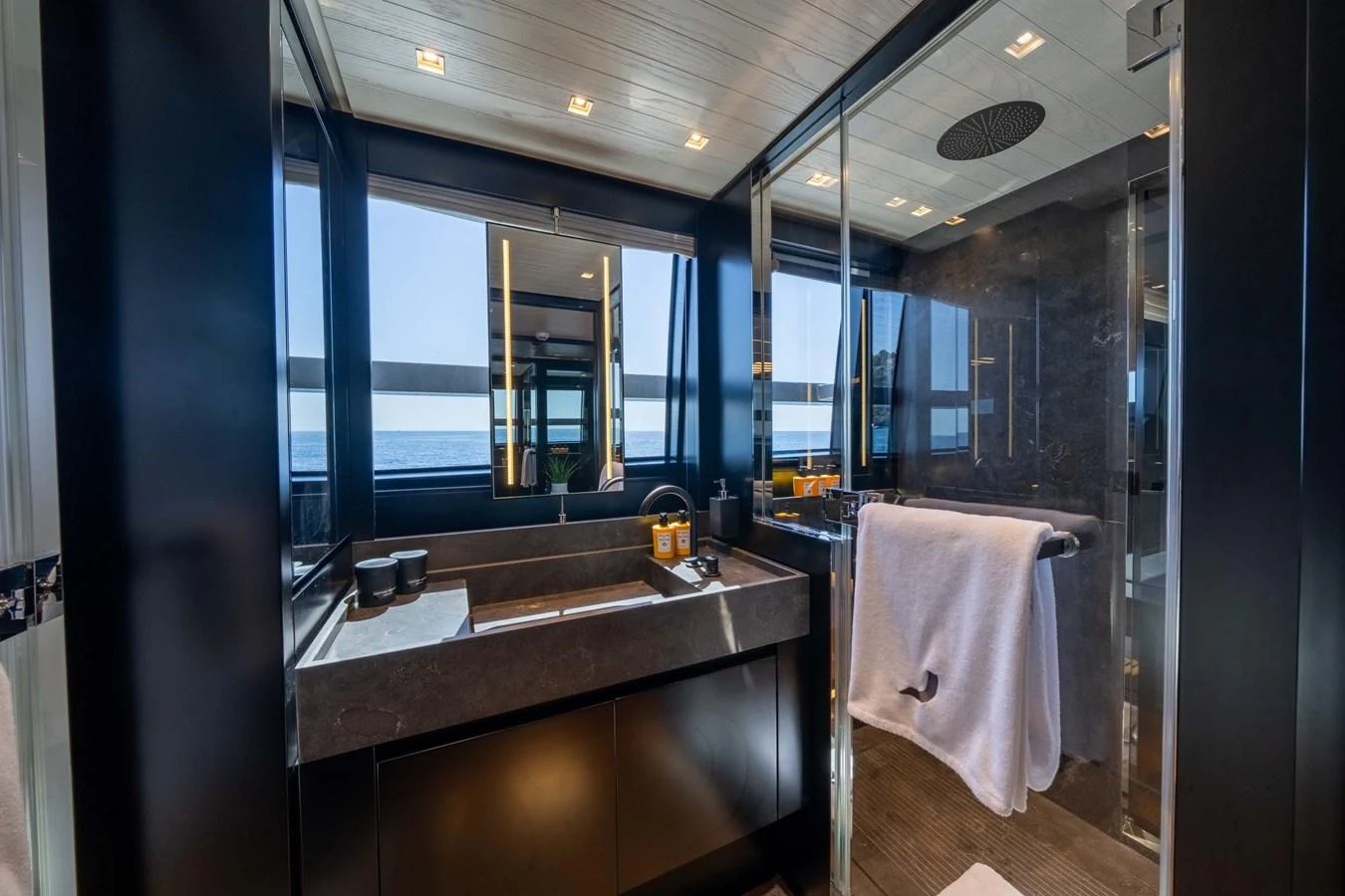A luxurious yacht bathroom with modern fixtures and a stunning ocean view. aboard JACKI 8 Yacht for Sale
