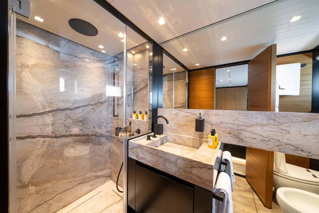 The yacht's bathroom features luxurious marble finishes and modern fixtures. aboard JACKI 8 Yacht for Sale