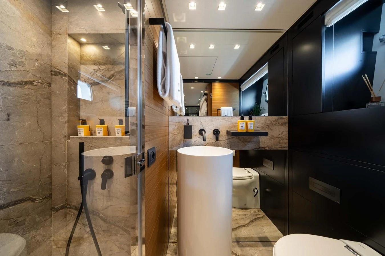 The yacht's bathroom features modern fixtures and luxurious marble finishes. aboard JACKI 8 Yacht for Sale