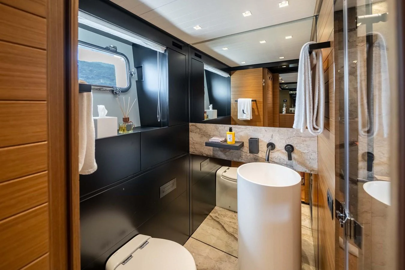 The yacht's bathroom features modern fixtures and a sleek design with ample natural light. aboard JACKI 8 Yacht for Sale
