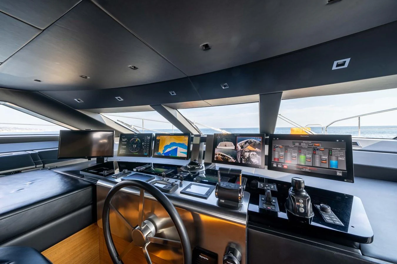 The helm station features advanced navigation and control systems with panoramic views. aboard JACKI 8 Yacht for Sale