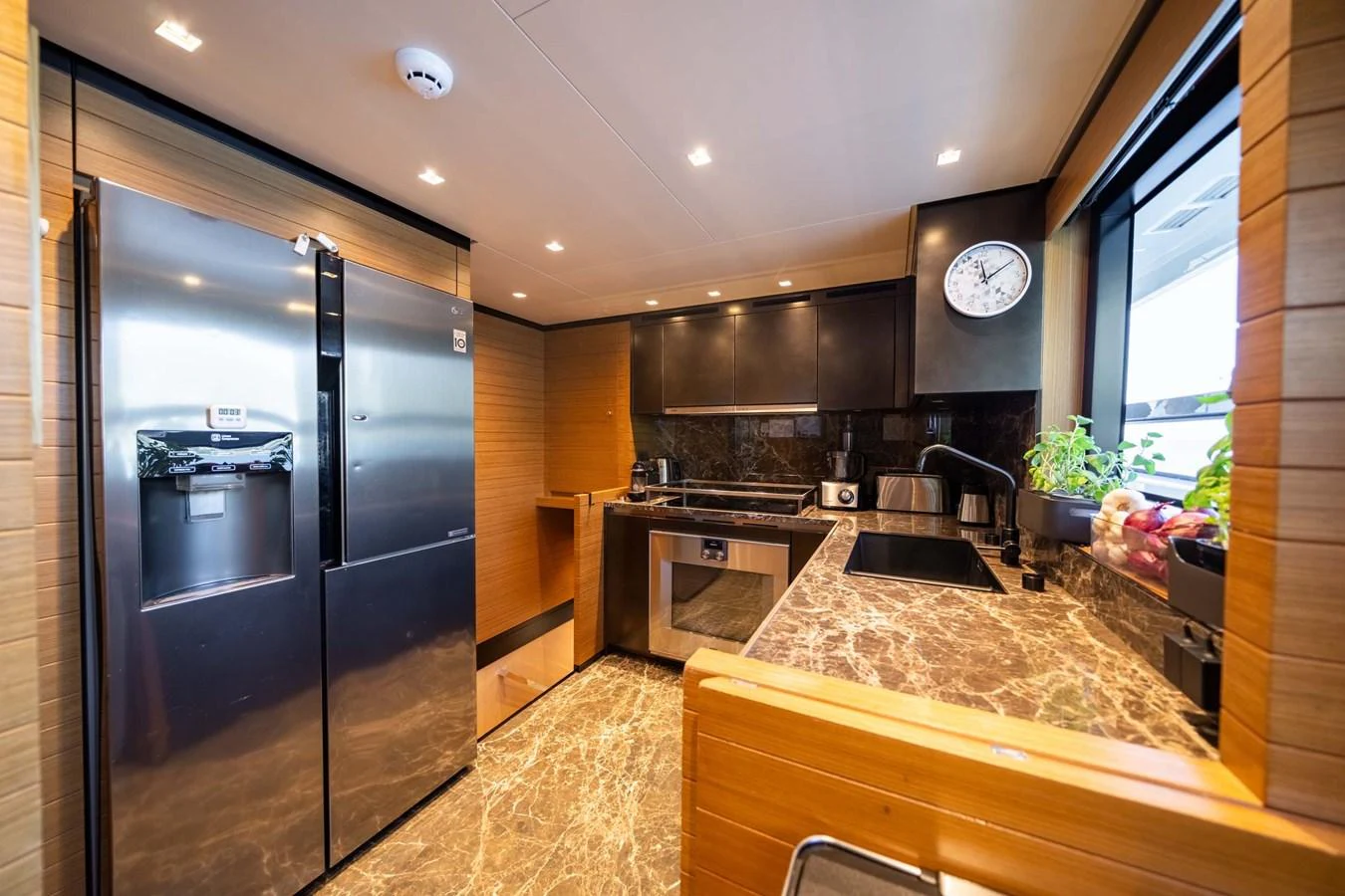 The galley features modern appliances and luxurious finishes, creating a sophisticated culinary space. aboard JACKI 8 Yacht for Sale
