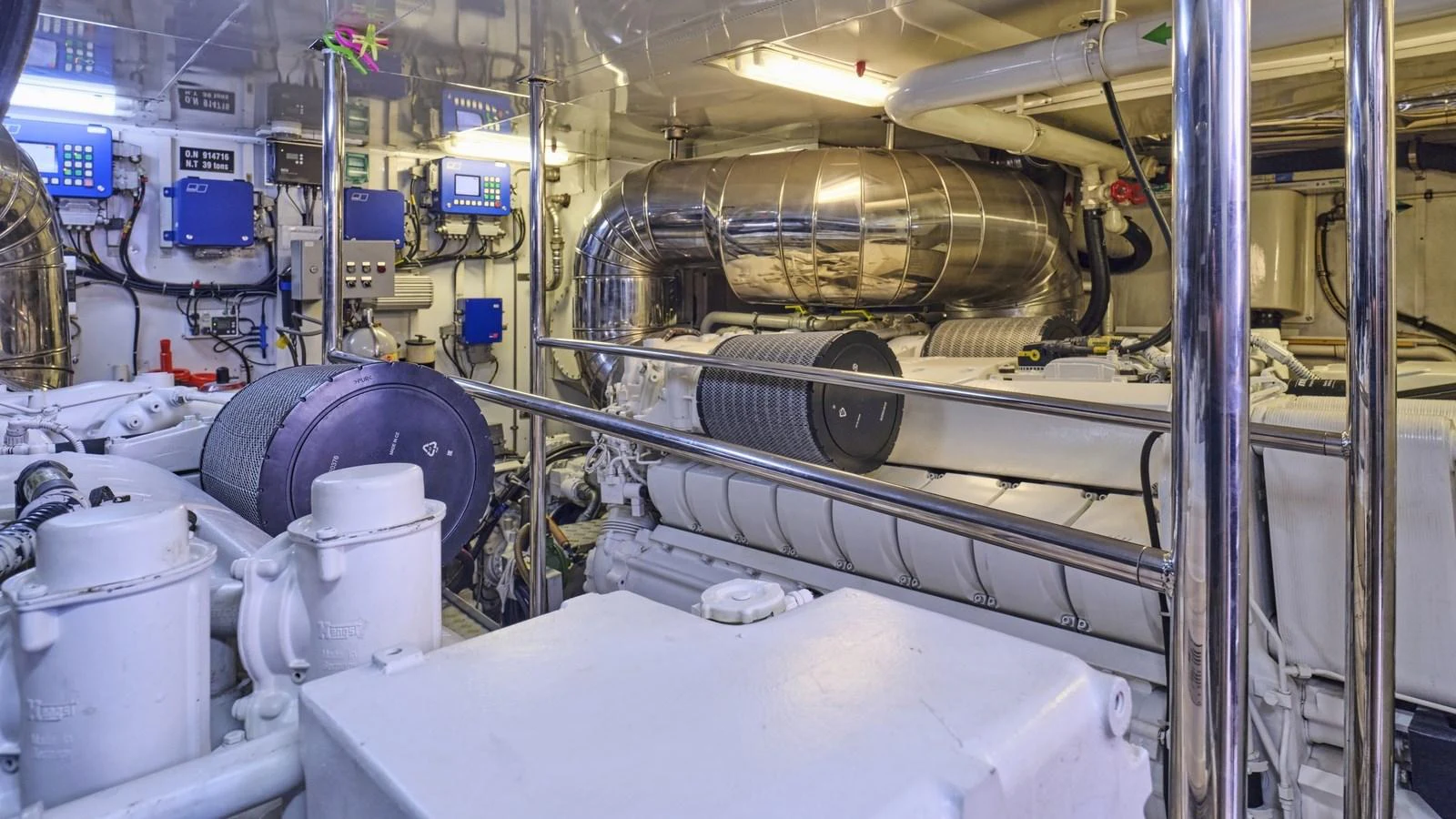 The yacht's engine room showcases advanced machinery and a well-organized layout. aboard OASIS Yacht for Sale