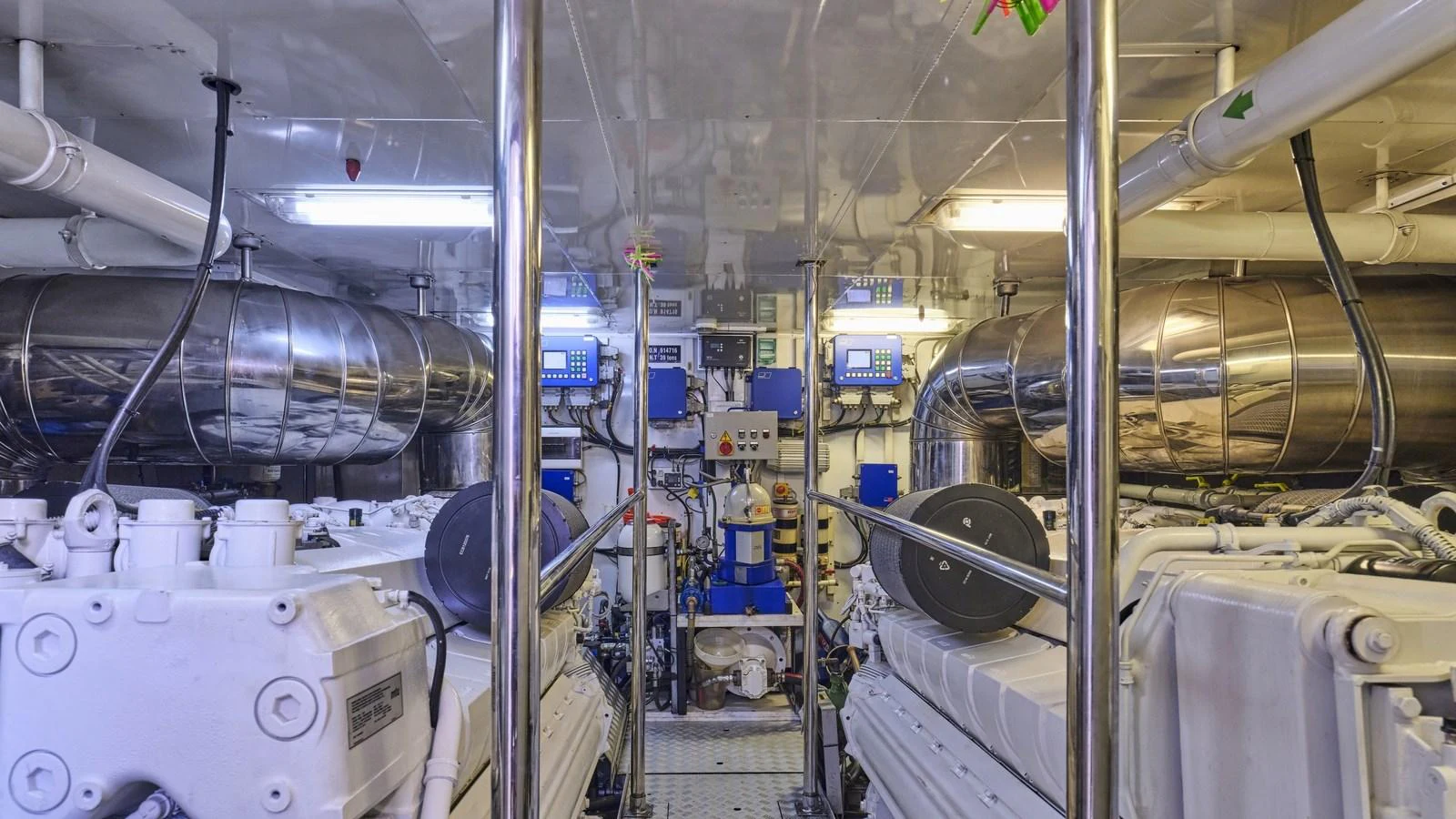 The image showcases the yacht's well-maintained engine room with advanced machinery and equipment. aboard OASIS Yacht for Sale