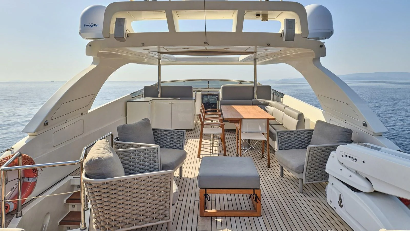 The flybridge offers a spacious and comfortable outdoor seating area with panoramic views. aboard OASIS Yacht for Sale