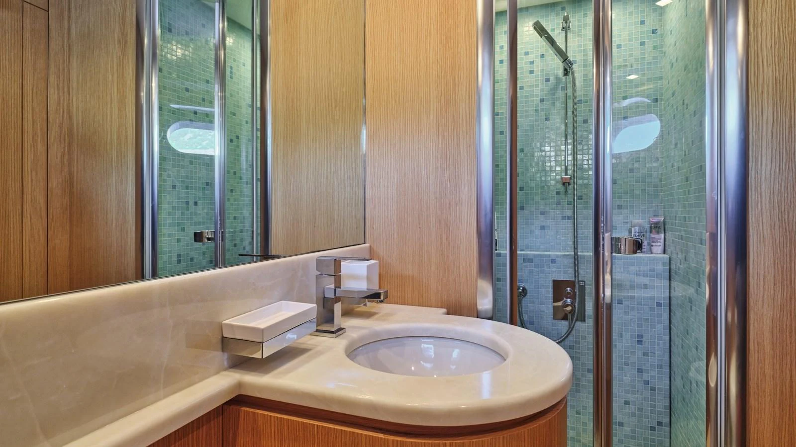 The yacht's bathroom features modern fixtures and a spacious shower area. aboard OASIS Yacht for Sale