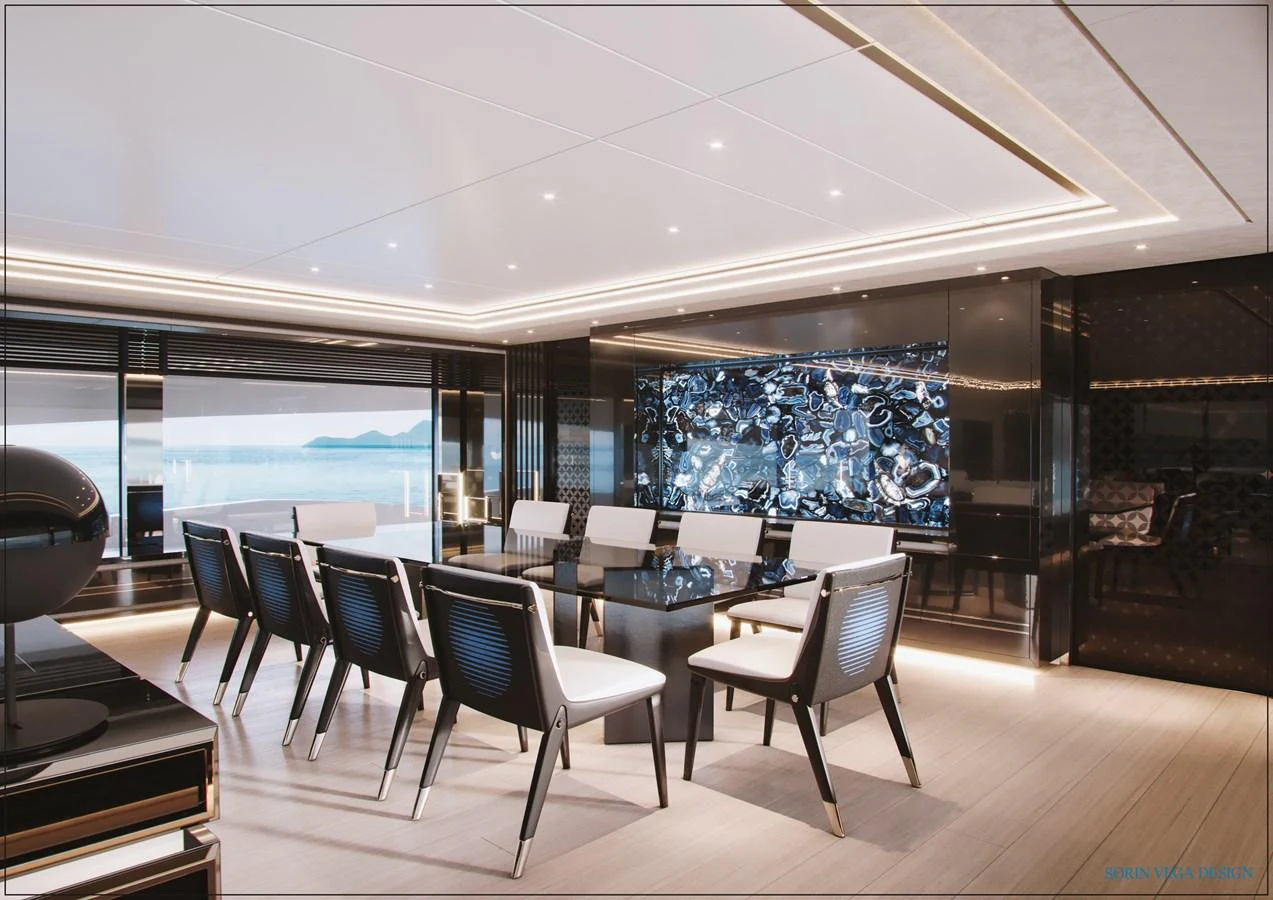 The yacht's dining area features a sleek, modern design with a large table and stylish chairs, complemented by a stunning ocean view. aboard SWAN 45M Yacht for Sale