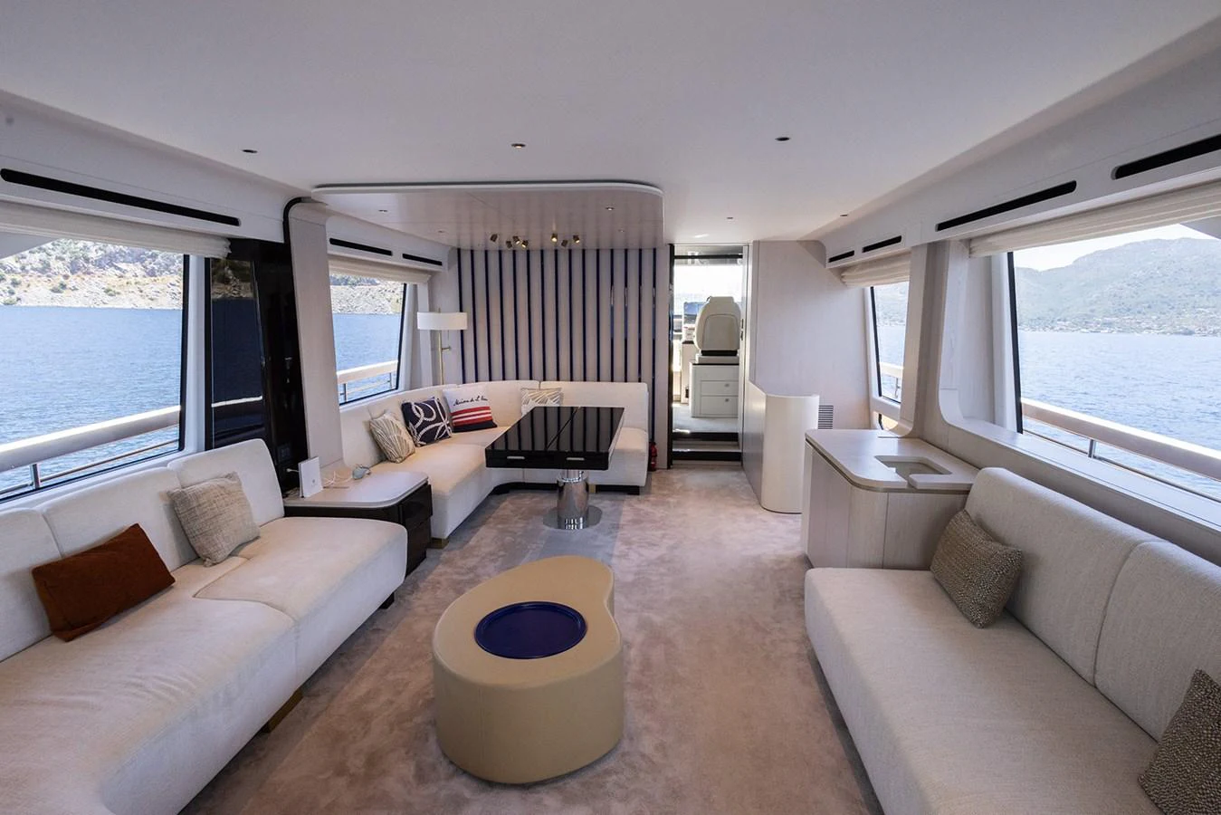 The salon offers a spacious and elegant living area with panoramic views of the sea. aboard MILES Yacht for Sale