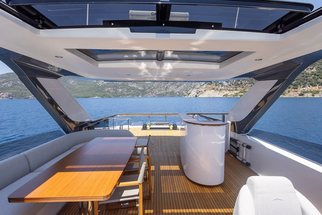 The aft deck offers a spacious and elegant area for dining and relaxation with stunning views of the surrounding waters. aboard MILES Yacht for Sale