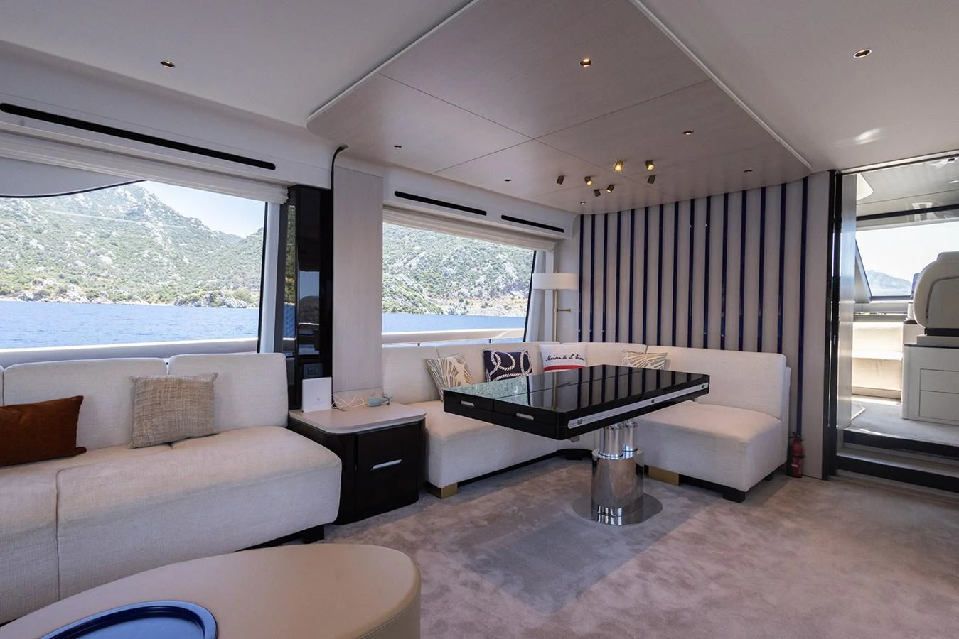 The salon offers a spacious and elegant seating area with panoramic views of the sea. aboard MILES Yacht for Sale