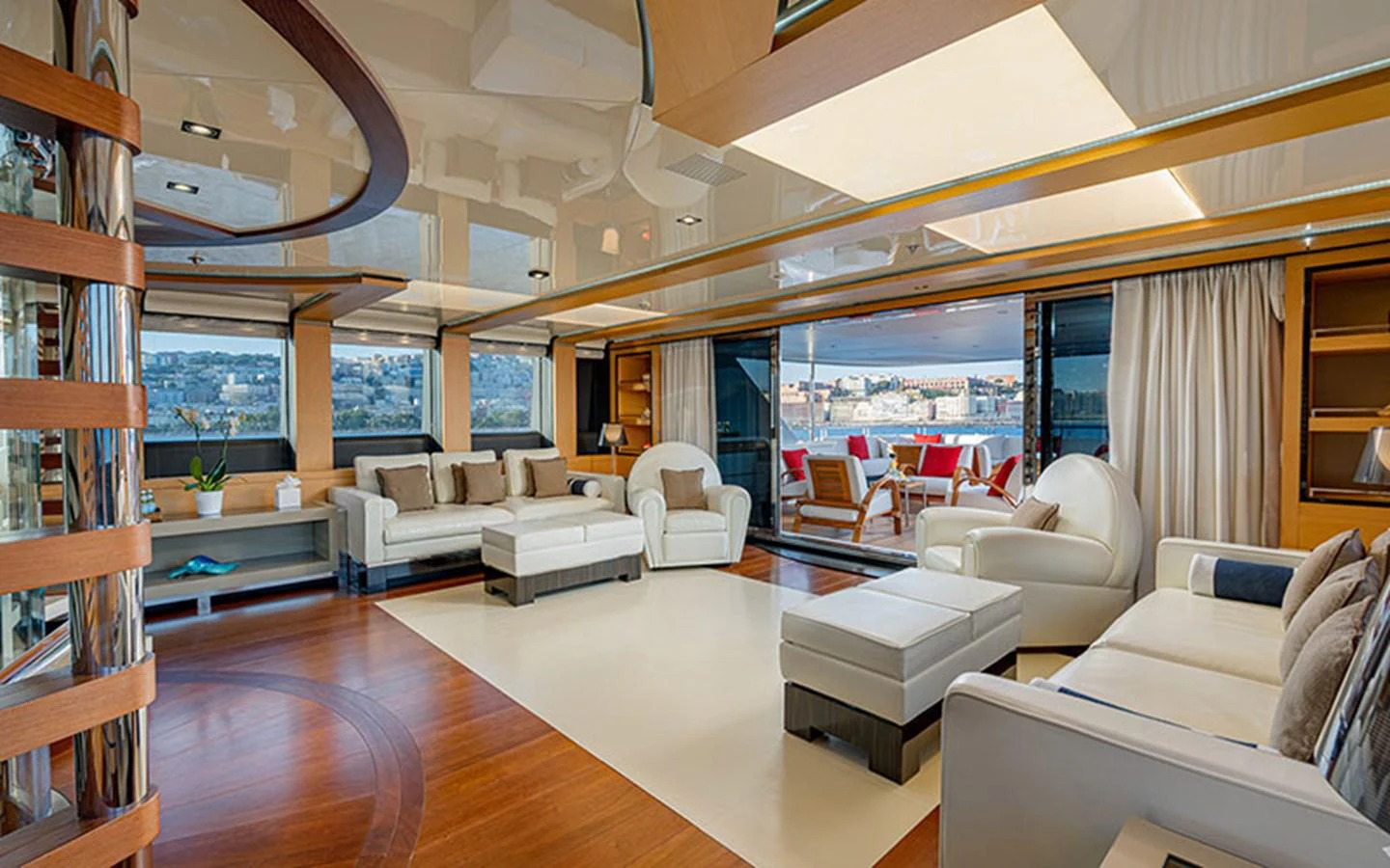 The spacious salon features modern furnishings and expansive windows offering stunning views. aboard 2 LADIES Yacht for Sale