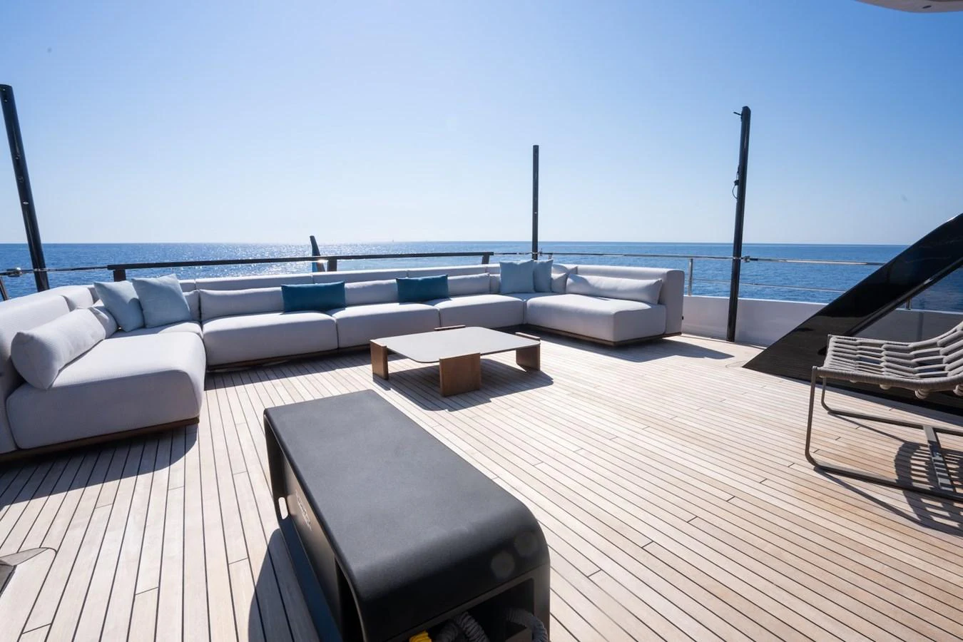 The sundeck offers a spacious lounging area with comfortable seating and stunning ocean views. aboard COME TOGETHER Yacht for Sale