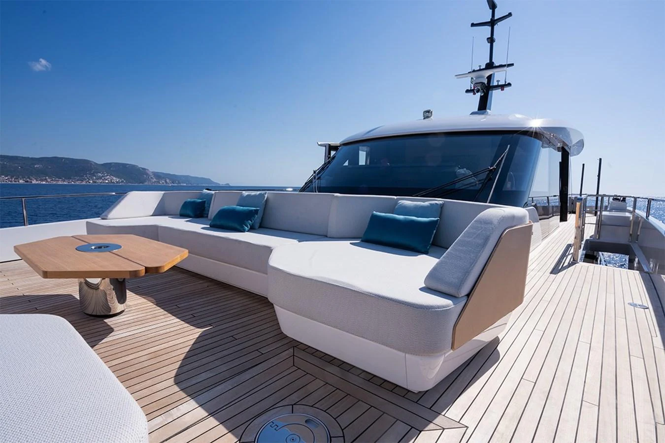 The yacht's foredeck features a spacious and stylish lounging area with plush seating and a sleek design. aboard COME TOGETHER Yacht for Sale