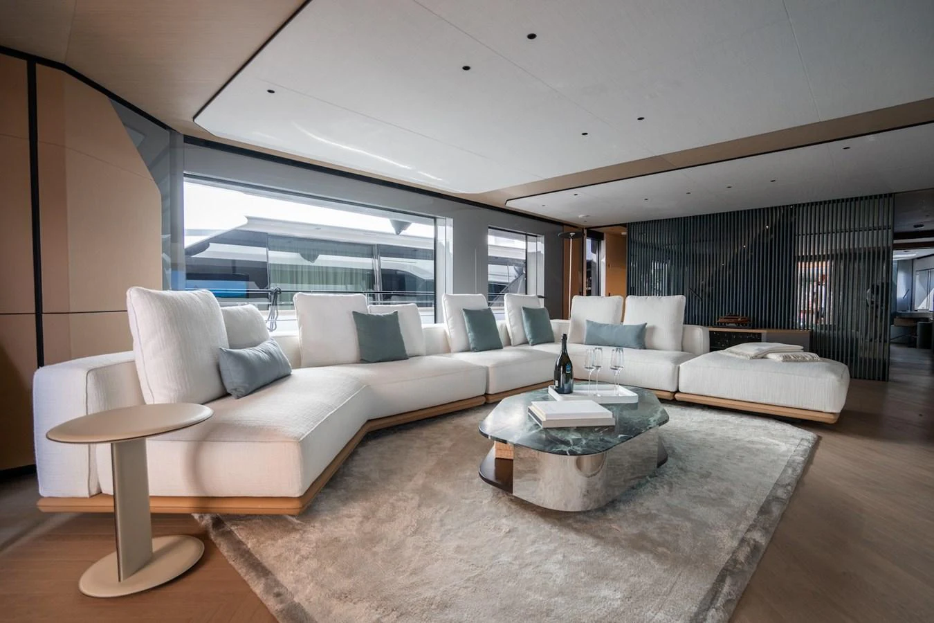 The yacht's salon features a spacious and elegantly designed seating area with modern furnishings. aboard COME TOGETHER Yacht for Sale
