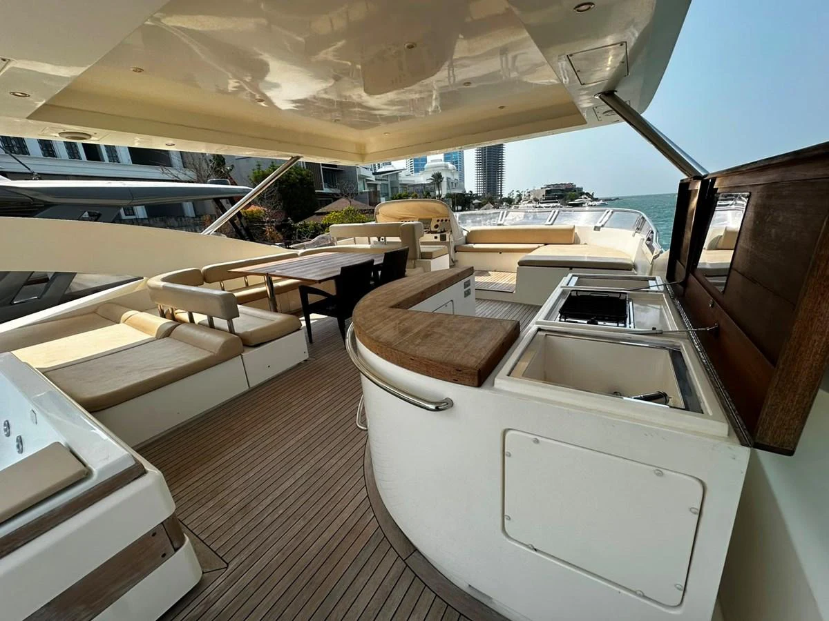 The flybridge offers a spacious and luxurious outdoor living area with ample seating and a well-equipped bar. aboard GALLEN Yacht for Sale