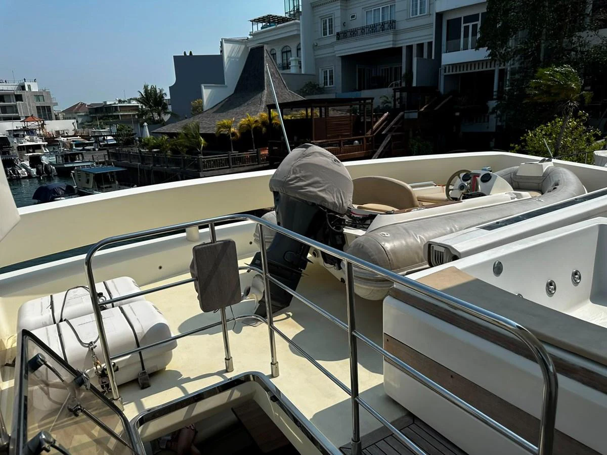The yacht's tender is securely stored on the deck, ready for convenient deployment. aboard GALLEN Yacht for Sale