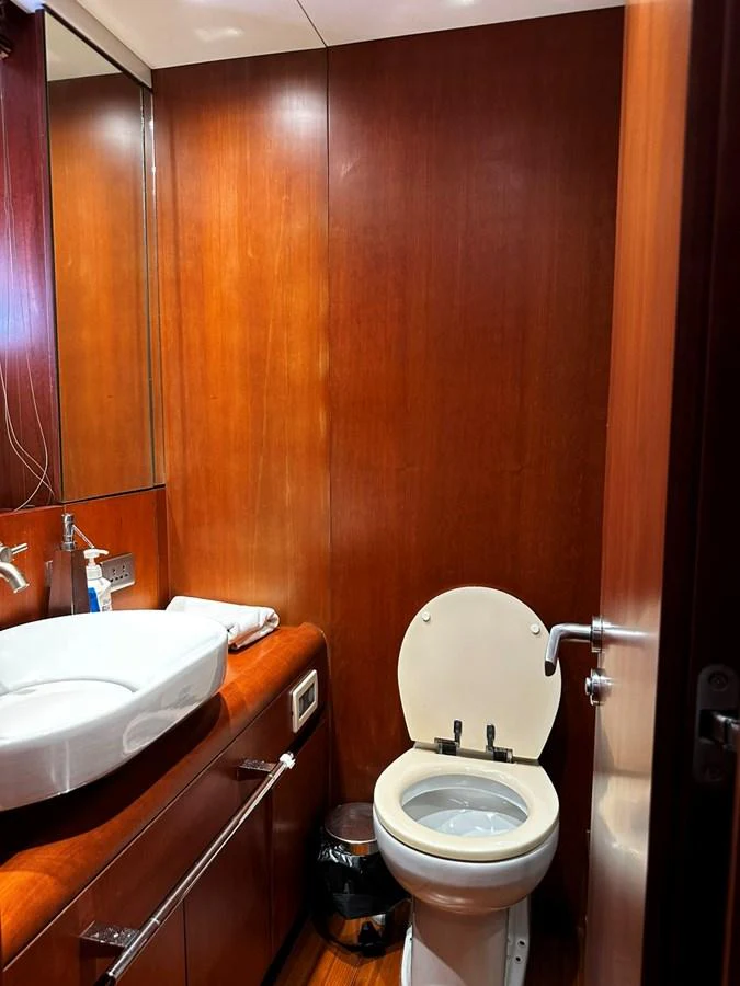 A compact and well-appointed yacht bathroom featuring a modern sink and toilet. aboard GALLEN Yacht for Sale