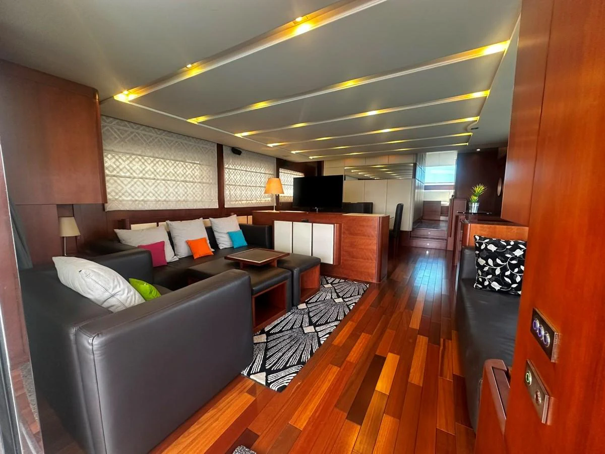 The yacht's salon features a stylish and comfortable seating area with modern decor and ample natural light. aboard GALLEN Yacht for Sale