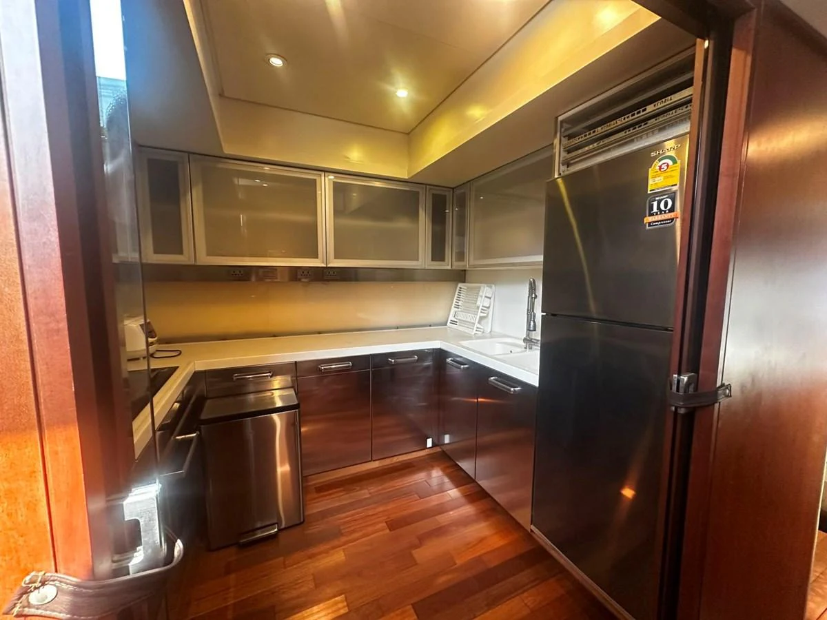 The galley features modern appliances and sleek cabinetry, perfect for gourmet meal preparation. aboard GALLEN Yacht for Sale