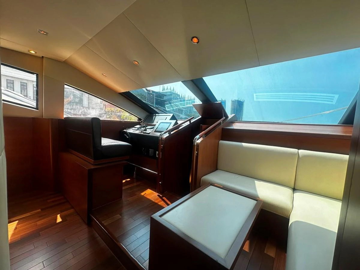 The helm area features a sleek design with ample natural light and comfortable seating. aboard GALLEN Yacht for Sale