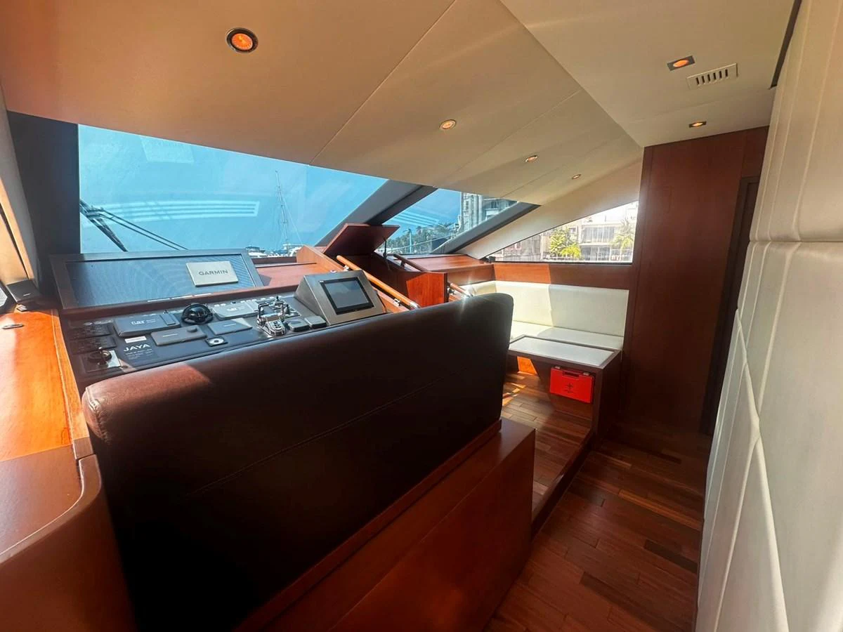 The helm station features a sleek design with advanced navigation equipment and comfortable seating. aboard GALLEN Yacht for Sale
