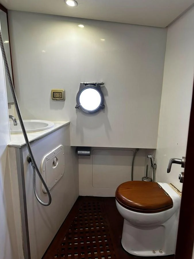 The yacht's head features a compact and functional design with modern fixtures. aboard GALLEN Yacht for Sale