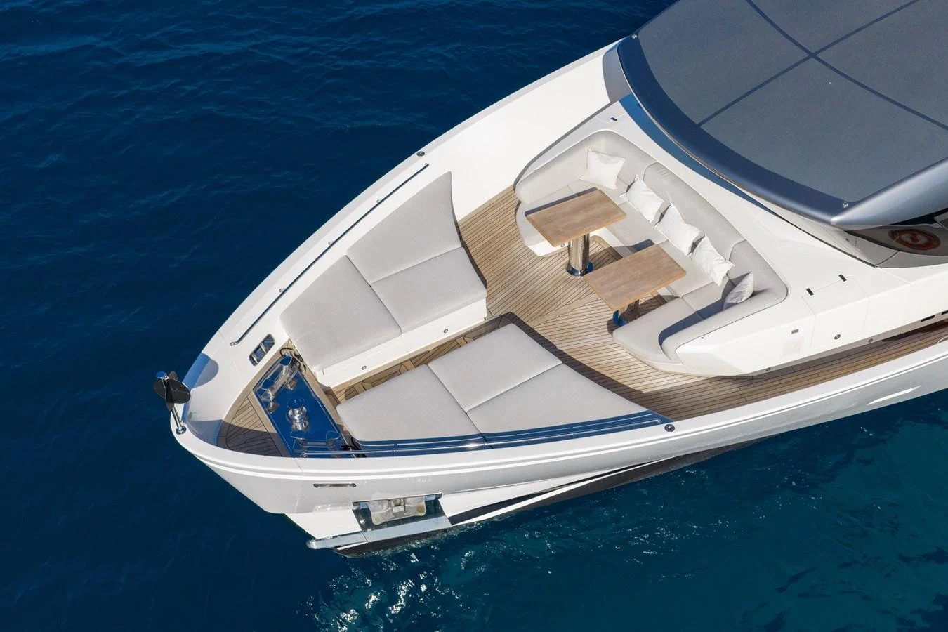 The foredeck features luxurious sun pads and a stylish seating area for relaxation. aboard JUNIOR Yacht for Sale