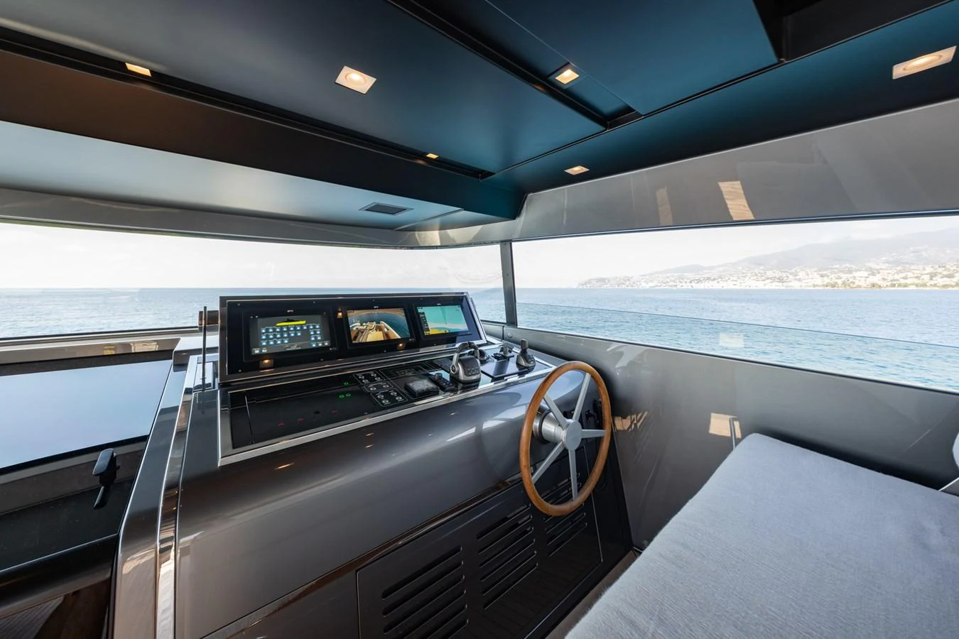 The helm station offers a sleek and modern design with panoramic views of the sea. aboard JUNIOR Yacht for Sale