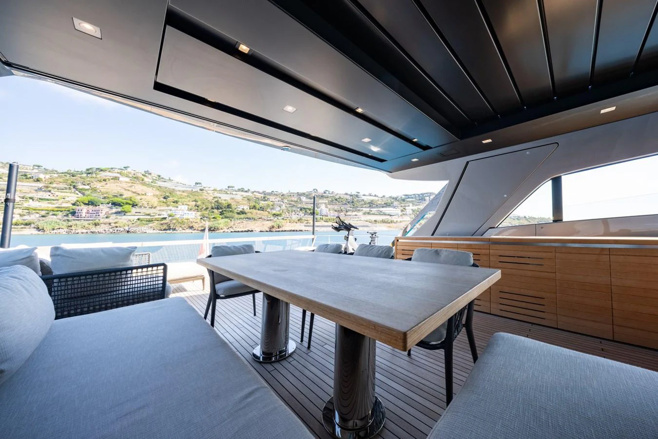 The aft deck offers a spacious and comfortable outdoor dining area with stunning views. aboard JUNIOR Yacht for Sale