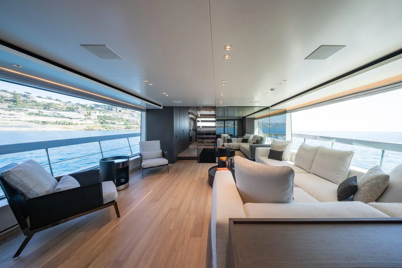 The spacious salon offers panoramic views and luxurious seating for relaxation. aboard JUNIOR Yacht for Sale
