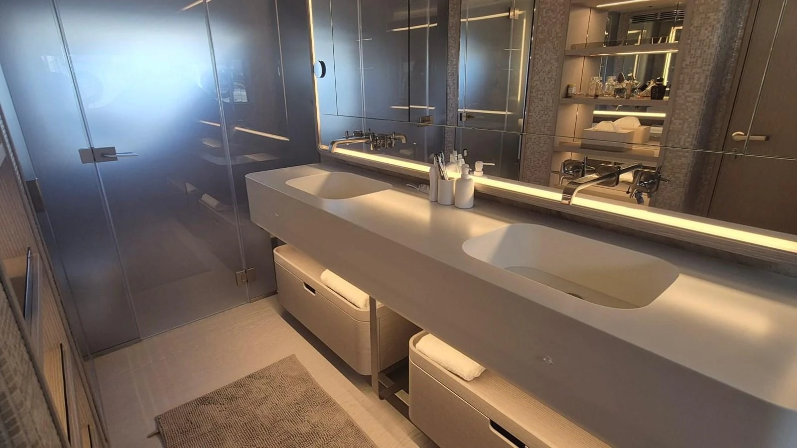 A luxurious yacht bathroom featuring dual sinks and modern fixtures. aboard SOLE Yacht for Sale