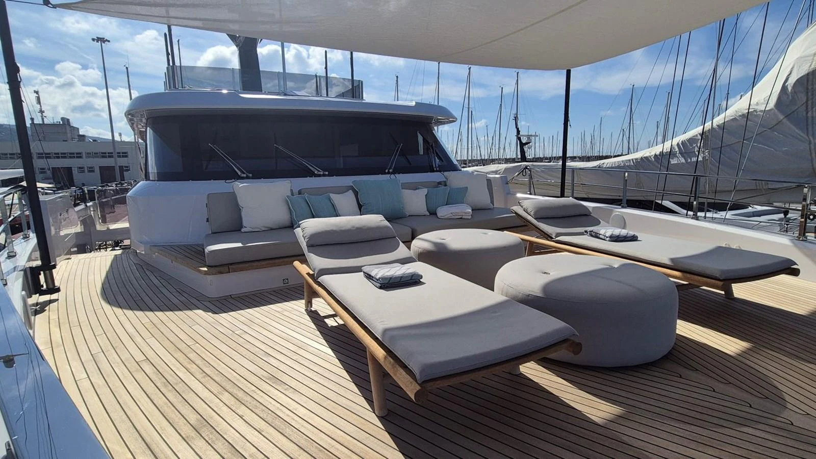 The sundeck offers luxurious lounging with sunbeds and shaded seating. aboard SOLE Yacht for Sale