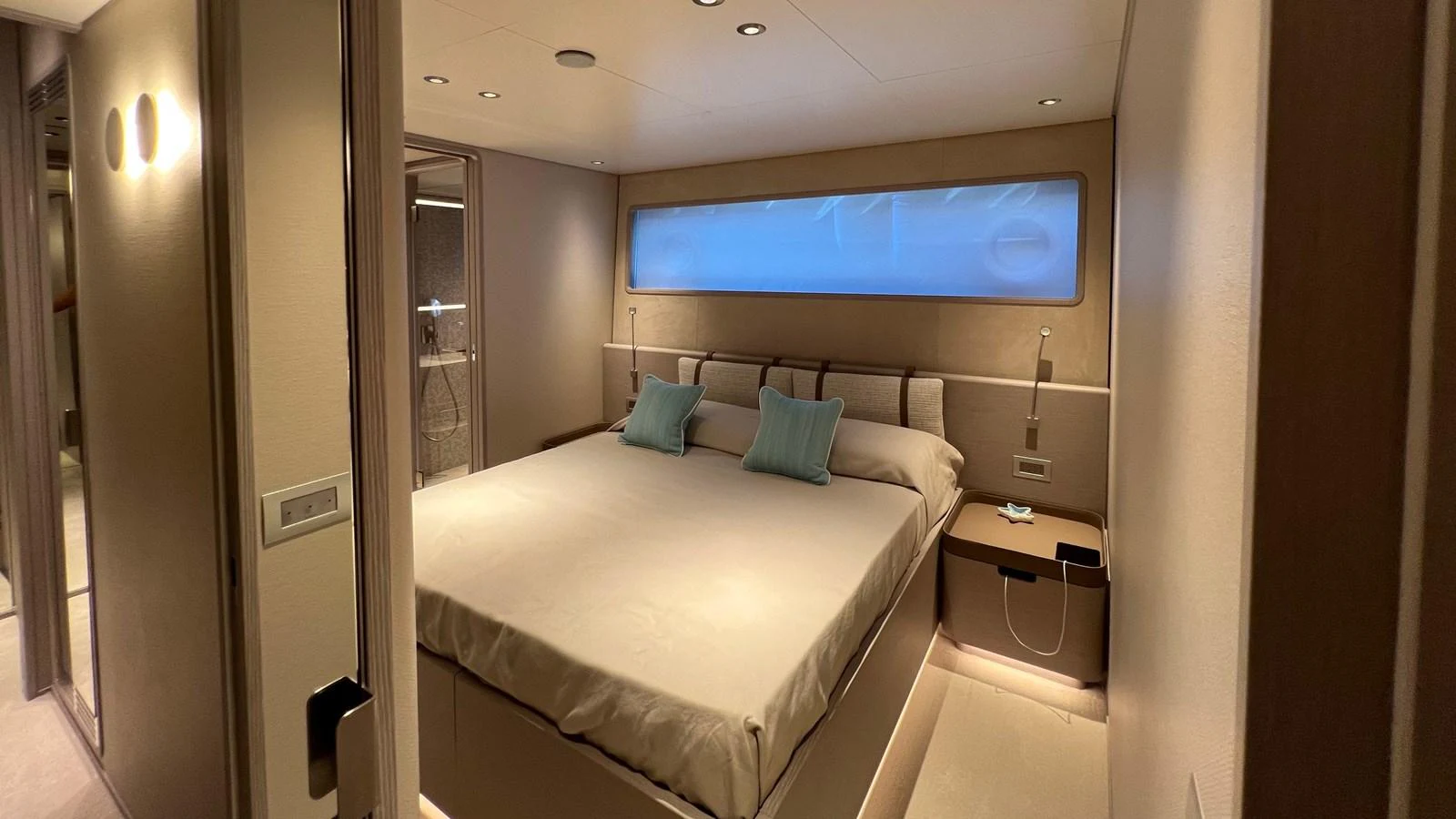 This image showcases a luxurious stateroom with a large bed and modern lighting. aboard SOLE Yacht for Sale