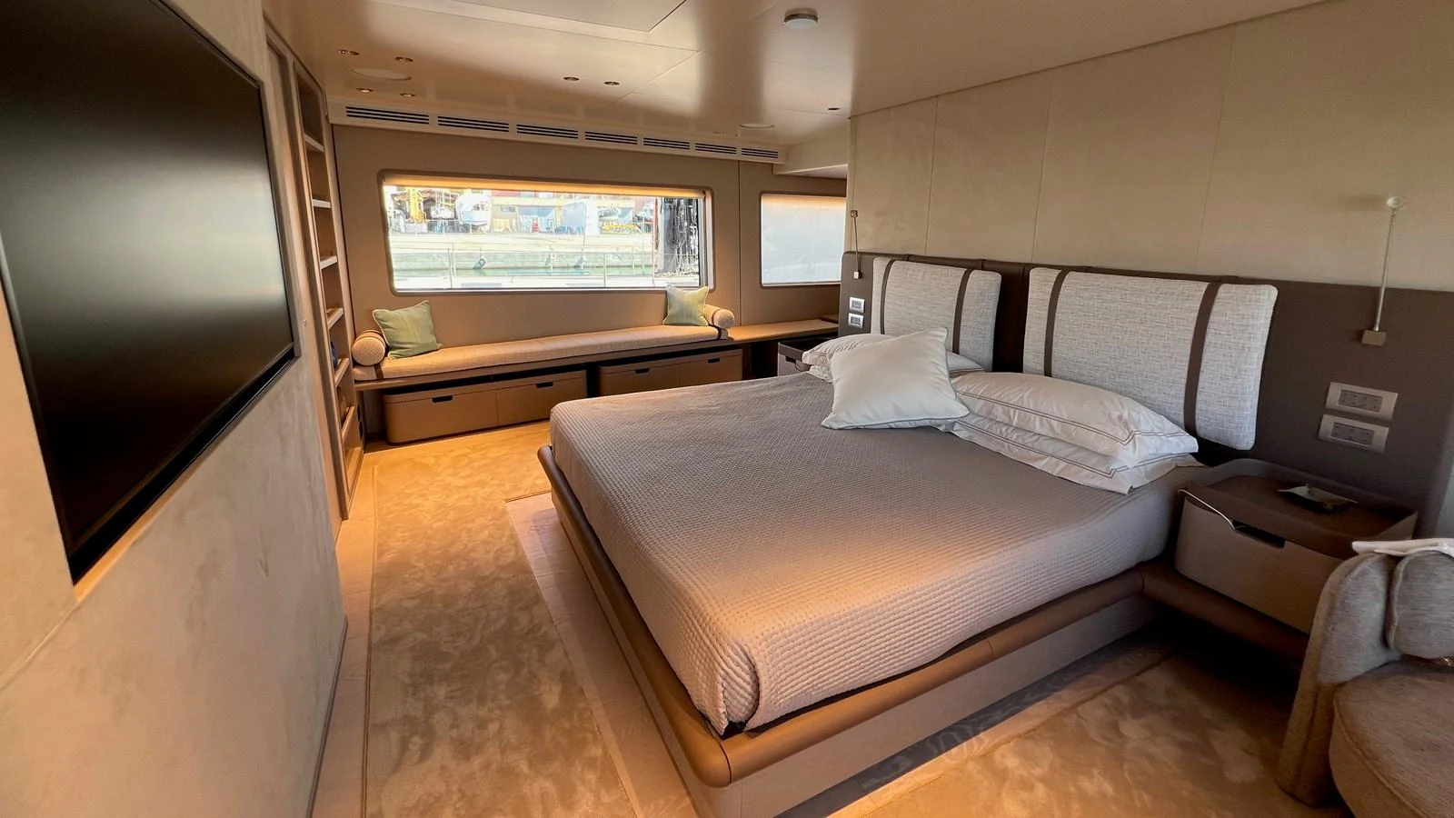 The master stateroom features a spacious bed, large windows, and elegant decor. aboard SOLE Yacht for Sale