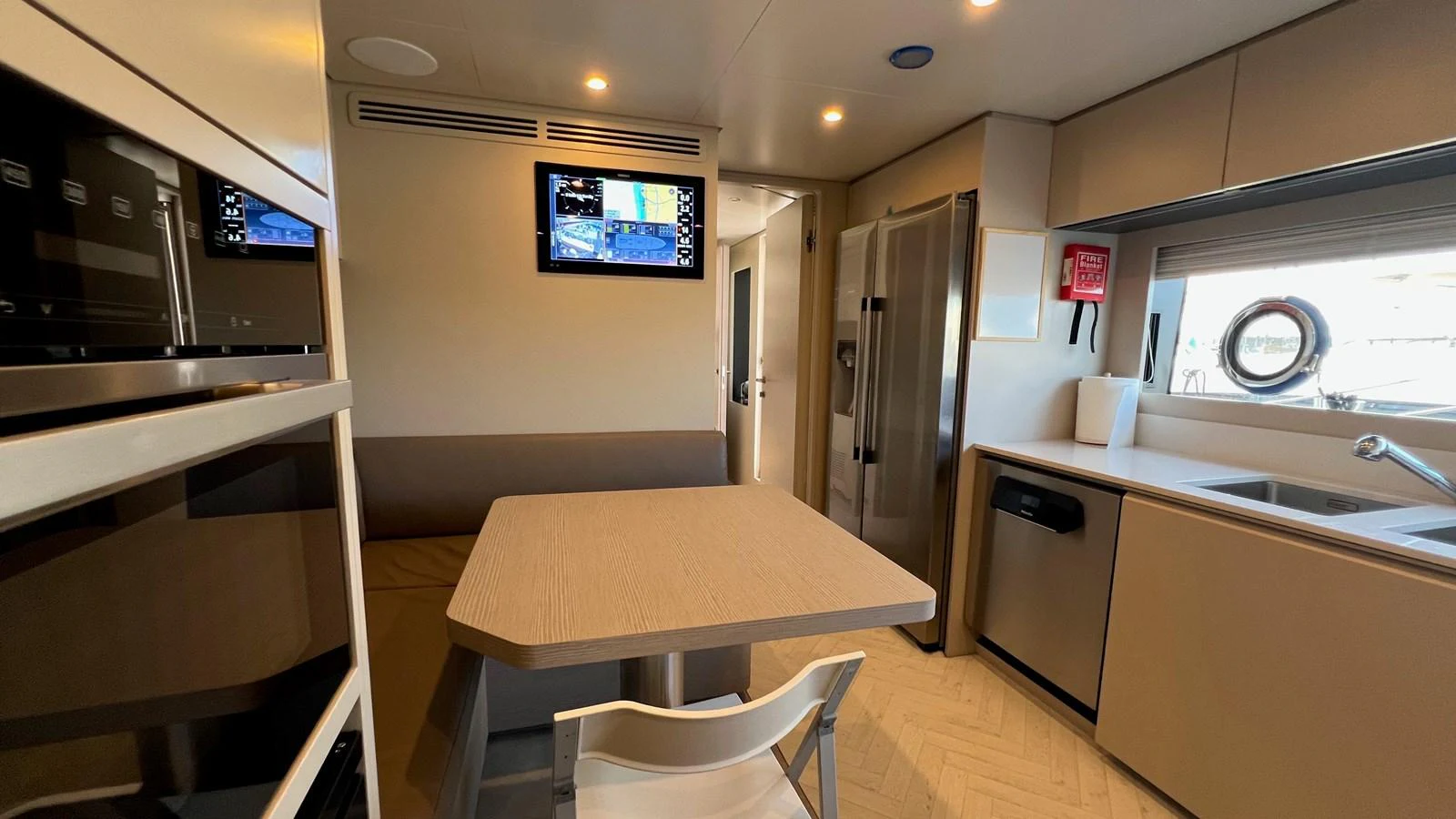 The yacht's galley features modern appliances and a cozy dining area. aboard SOLE Yacht for Sale