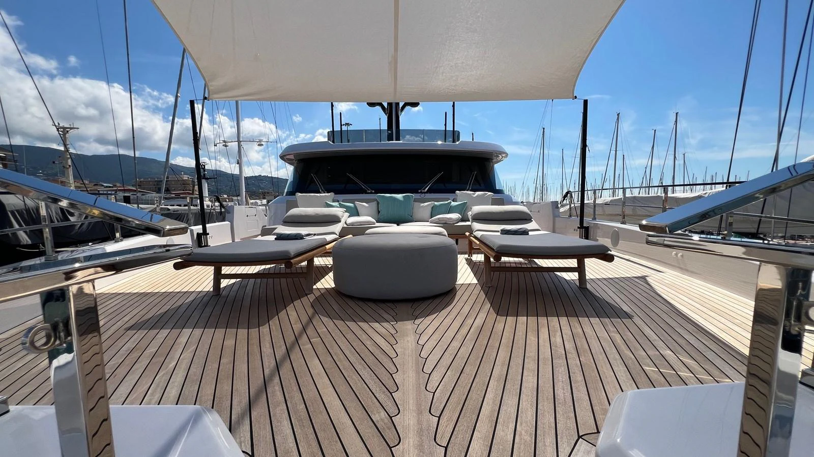 The foredeck features luxurious sun loungers and a shaded seating area, perfect for relaxation. aboard SOLE Yacht for Sale