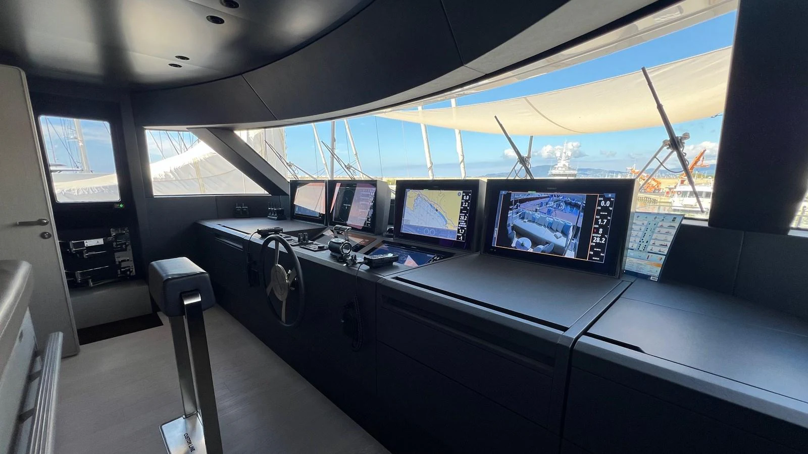 The helm station features advanced navigation equipment and a sleek, modern design. aboard SOLE Yacht for Sale
