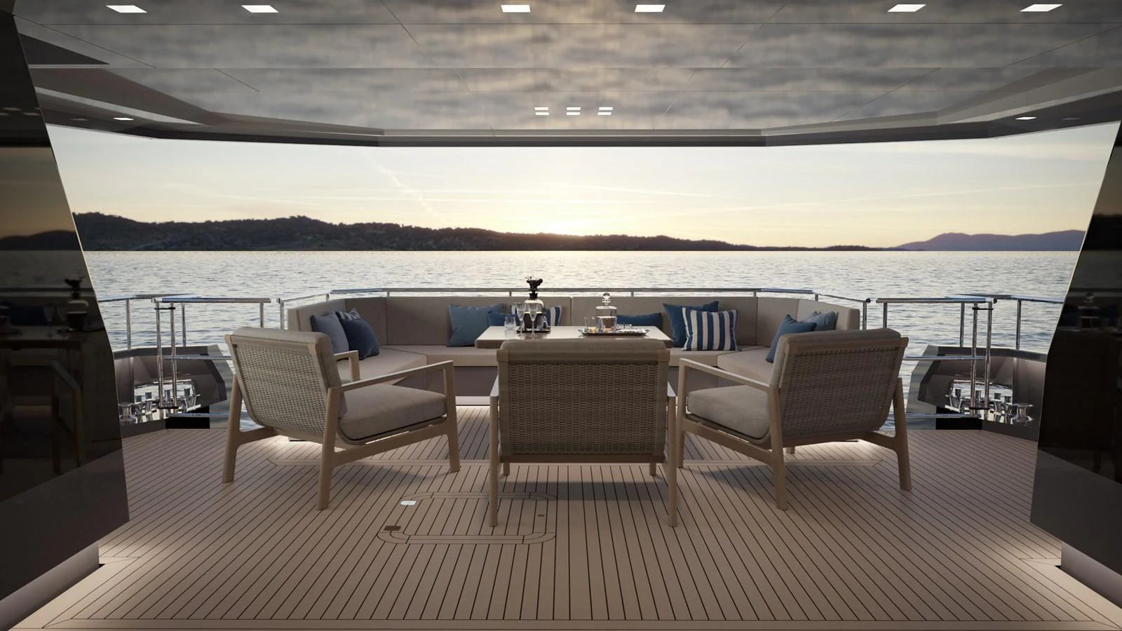 The aft deck offers a serene seating area with a stunning view of the water at sunset. aboard KINGSHIP KS88 Yacht for Sale