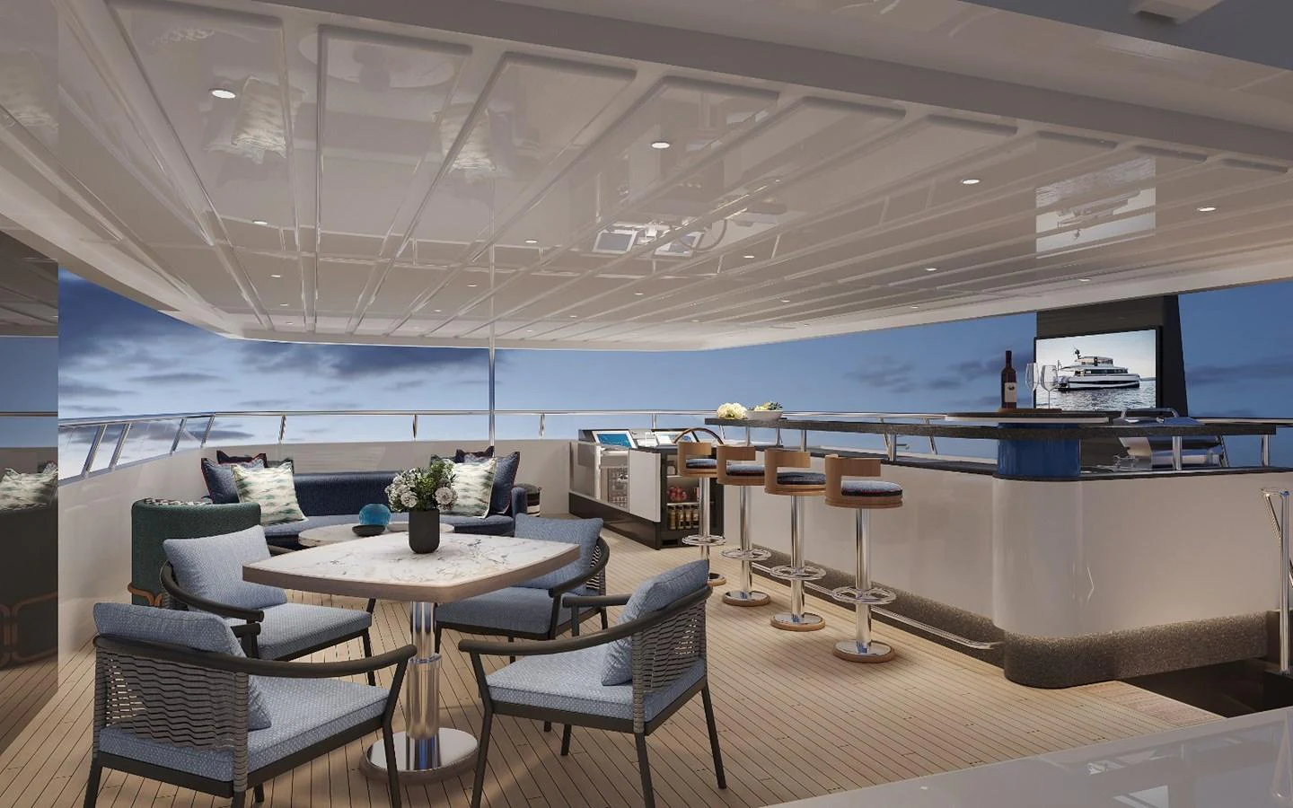 The aft deck features a stylish seating area with a bar and a dining table, perfect for entertaining guests. aboard KINGSHIP KS88 Yacht for Sale