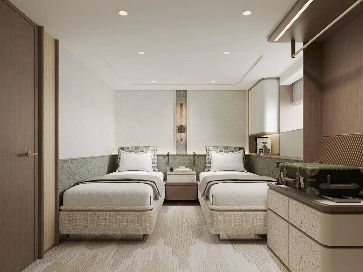 The guest stateroom features twin beds with elegant decor and modern lighting. aboard KINGSHIP KS88 Yacht for Sale